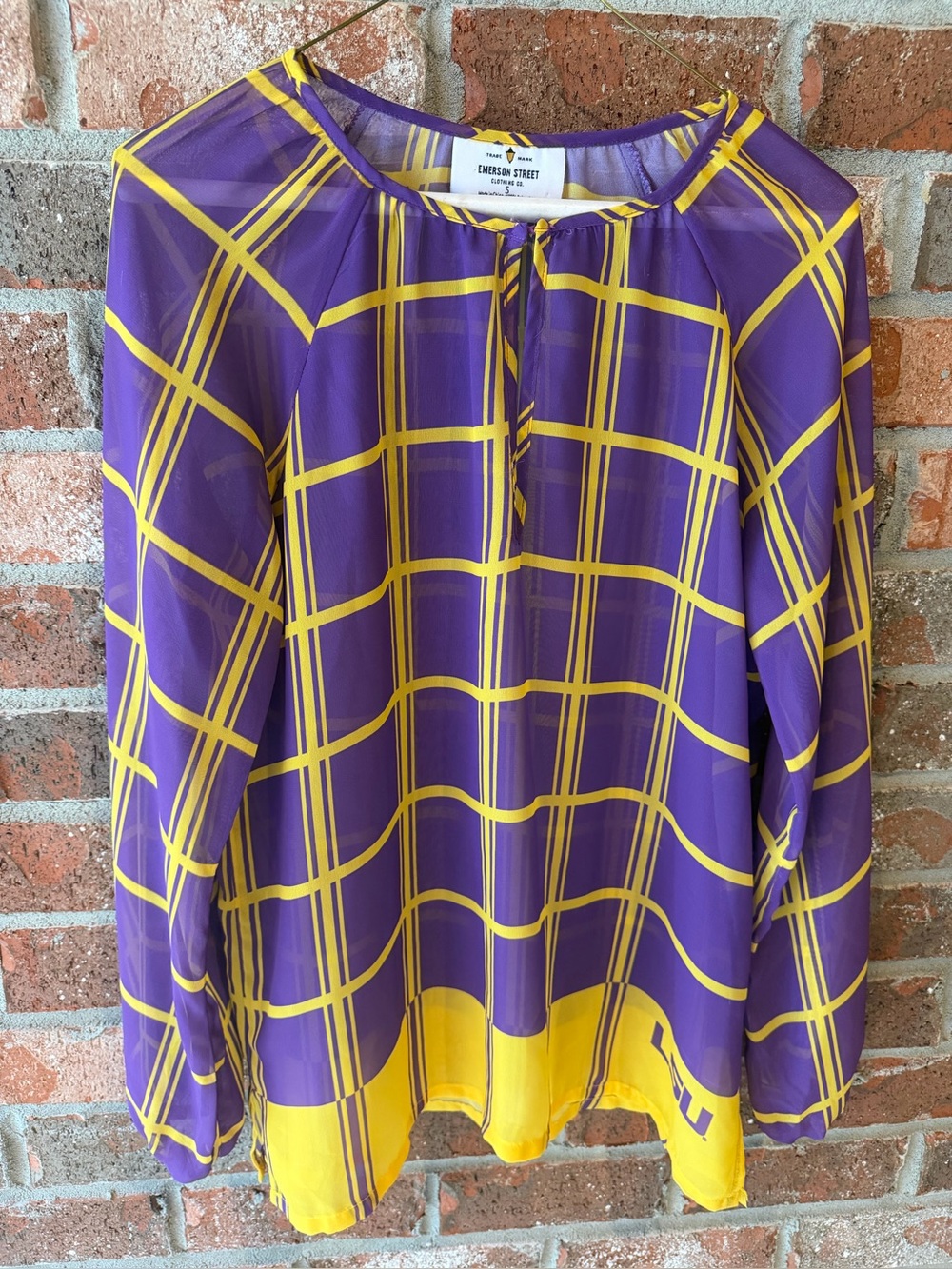 Emerson Street Clothing sheer purple and gold plaid gameday blouse featuring the